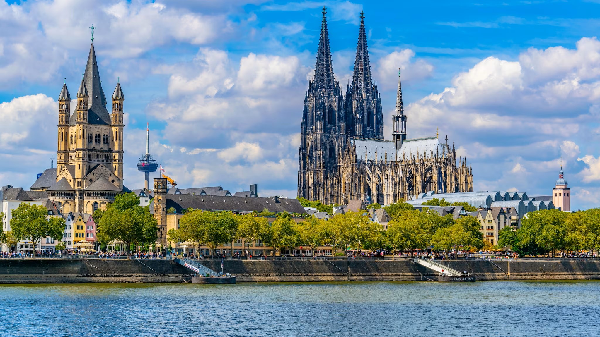 cityscape_of_cologne_with_hohenzollern_bridge_cathedral_and_saint_martin_church_germany.jpg